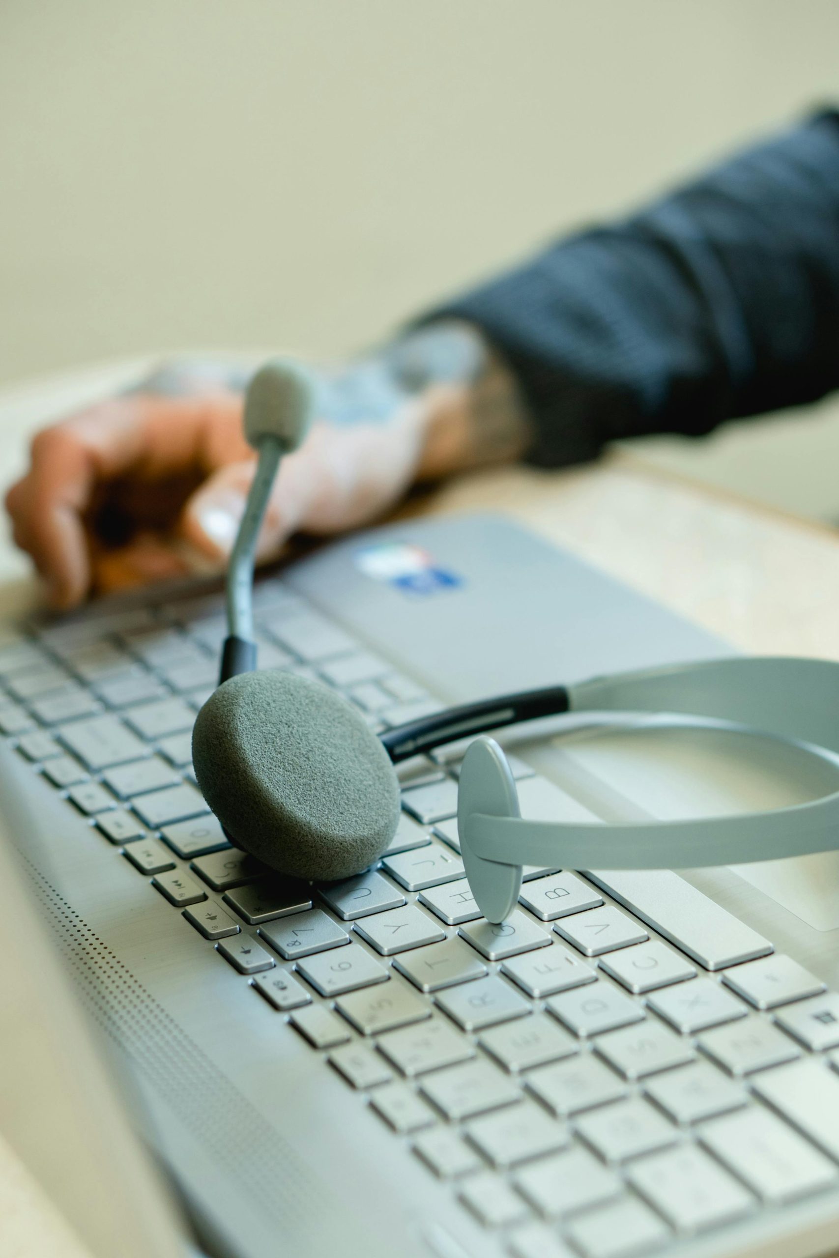 Call center setup with headphones and laptop, showing customer service best practices.