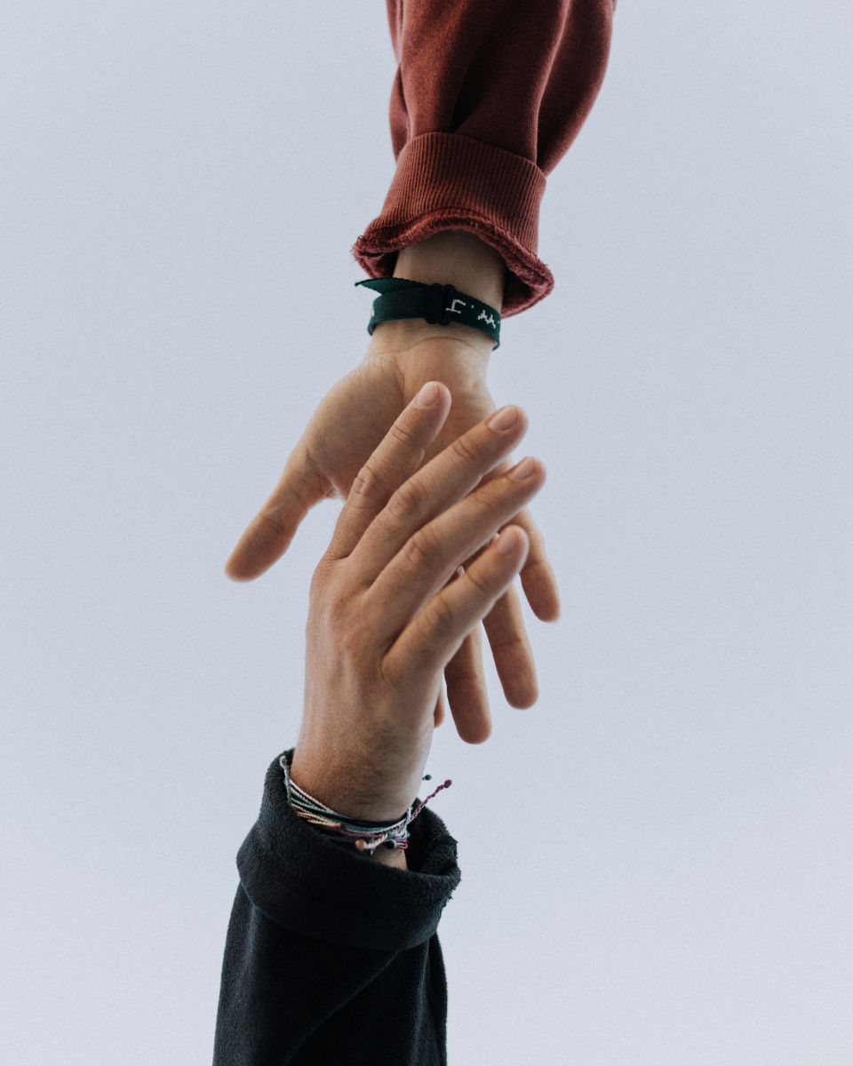Close-up handshake illustrating an agreement on strategies for how to scale customer support.