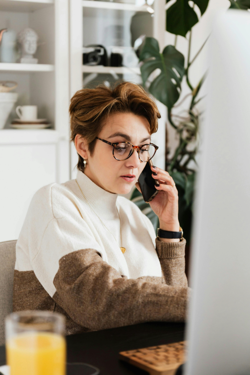 Woman taking customer service calls, representing the best customer support channels for fast assistance.
