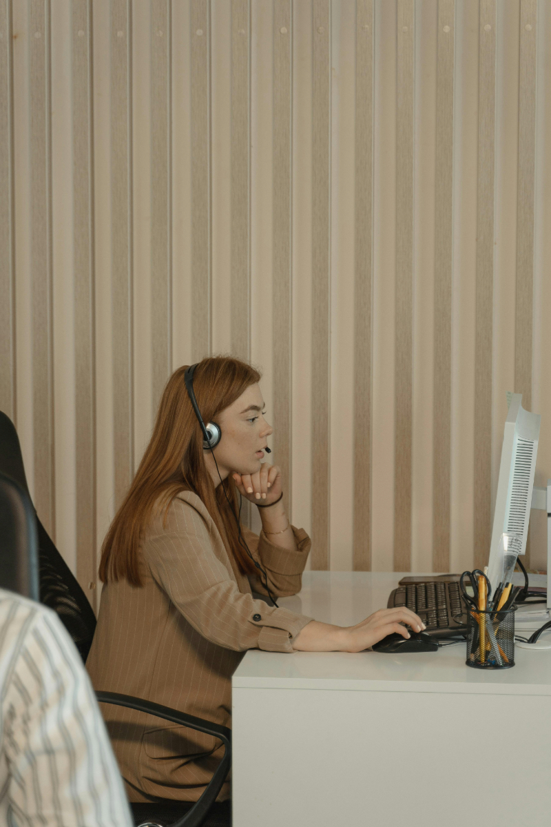 Customer service representative with a headset working for leading call center service providers.