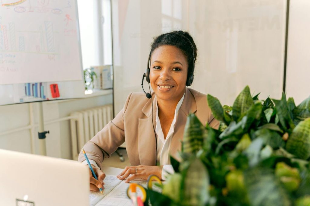 Customer support agent taking calls, demonstrating how to improve customer support with professional and efficient service.