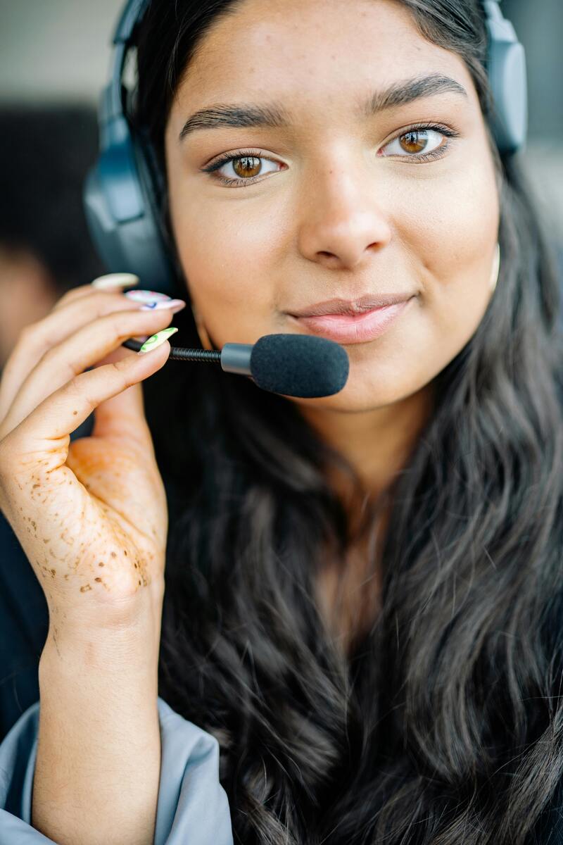 Customer service agent wearing a headset delivering AI-powered customer support