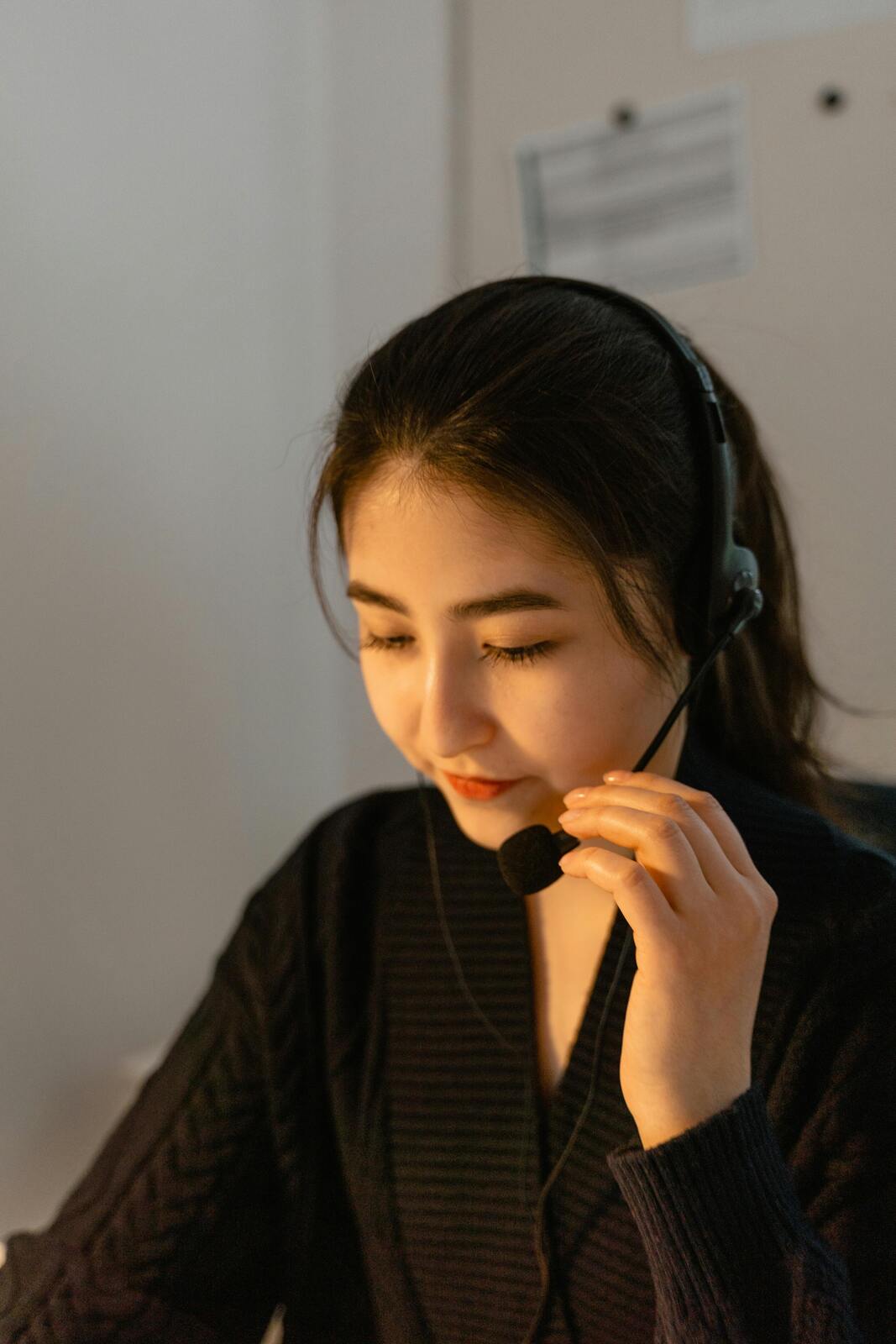 Customer service representative taking calls to enhance global customer experience for international clients