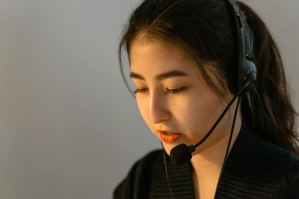 Female customer service representative handling calls using AI customer service solutions