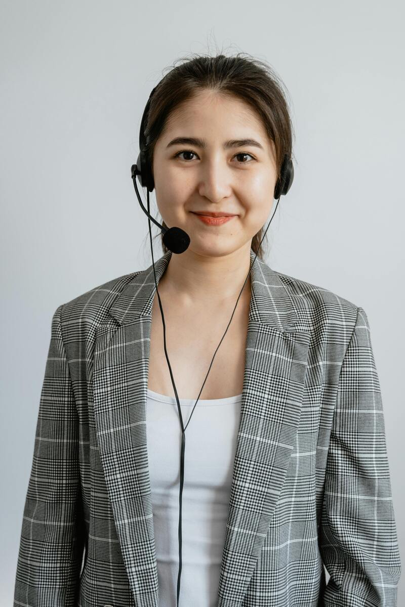 Multilingual customer support representative assisting customers through phone and chat