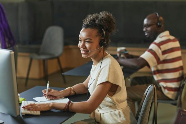 Team of call center agents taking calls, delivering predictive customer service