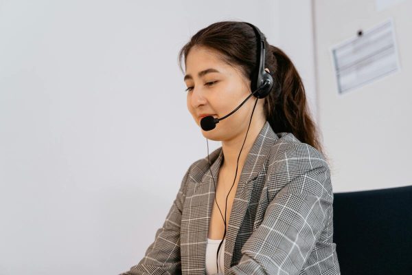 Customer service agent handling calls for small business customer support outsourcing