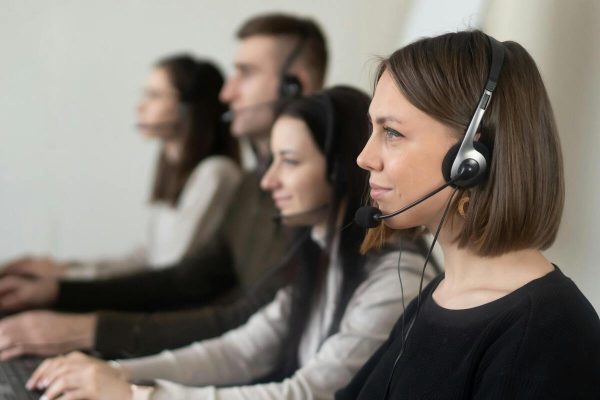 Customer support team delivering a personalized customer service experience while taking calls