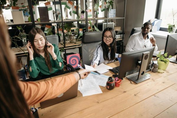 Client retention techniques shown through call center agents assisting customers over the phone