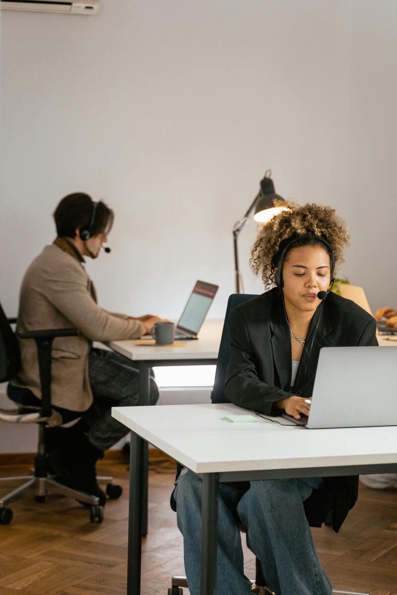 Customer service team on calls illustrating customer service technology trends