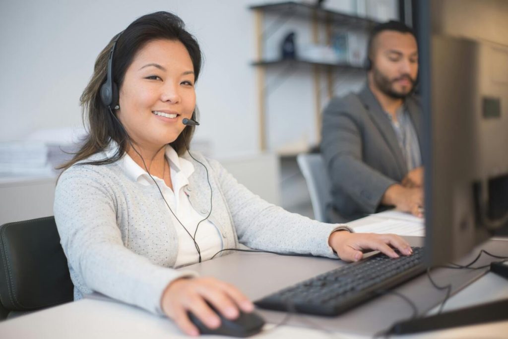 Chinese call center agents handling customer inquiries supported by an automated response system
