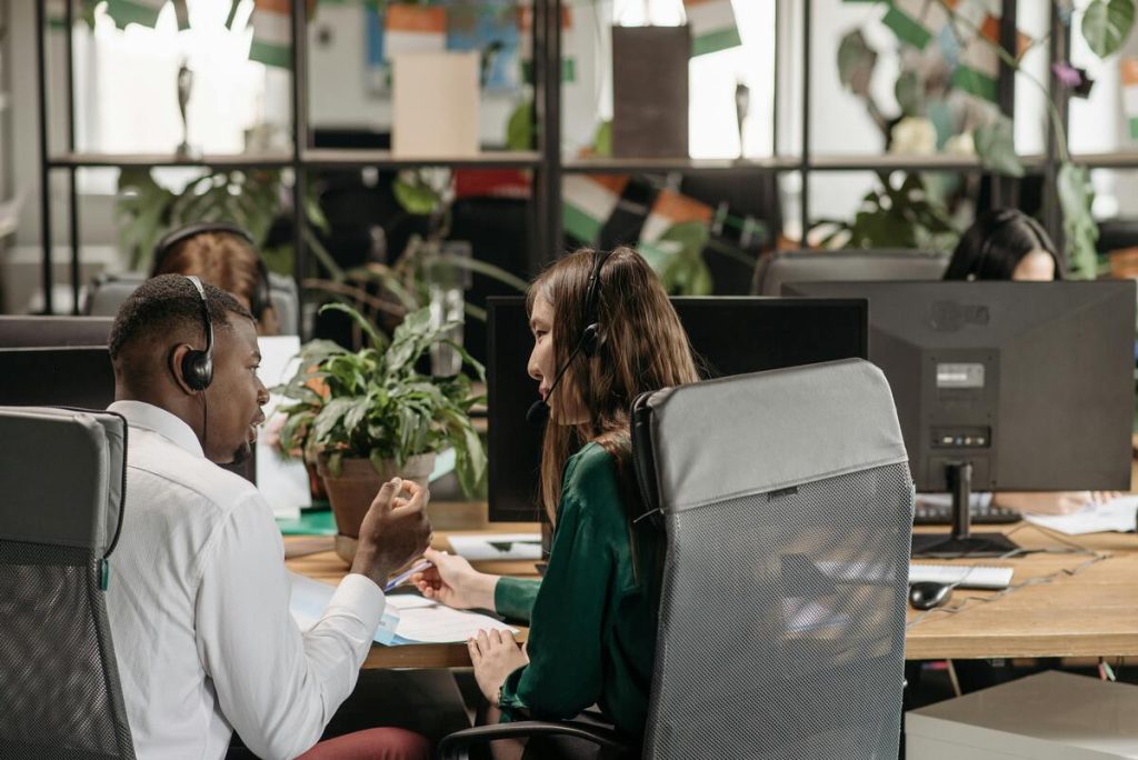 Chinese and African Call center agents providing customer retention services by handling client calls