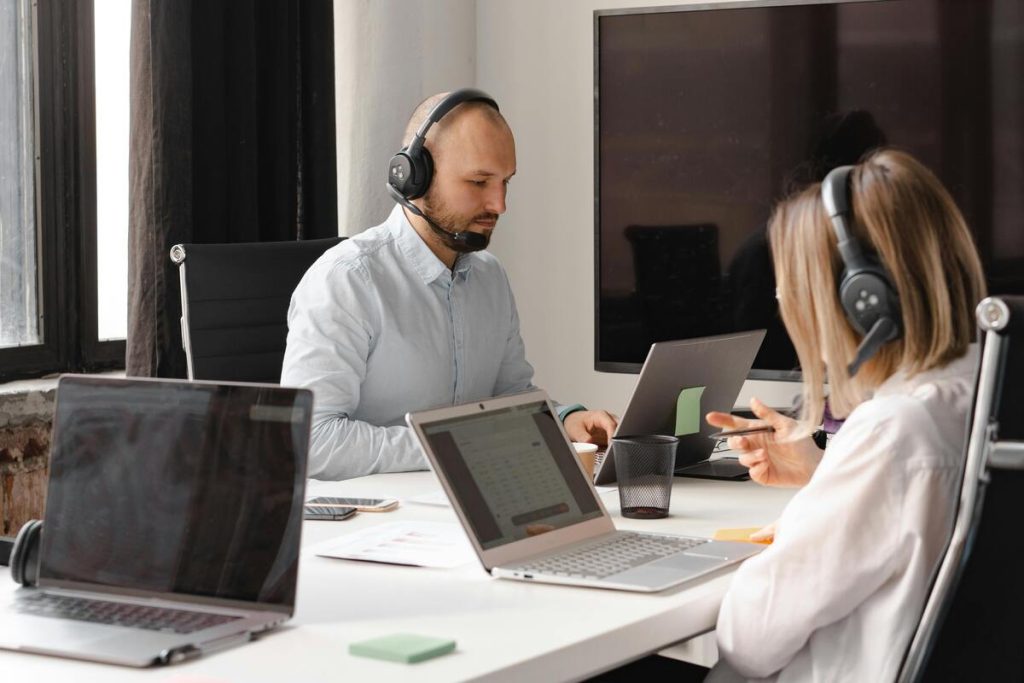 Team of call center agents handling customer inquiries using business support services