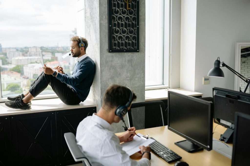 Call center agent providing outsourced live chat support in friendly environment