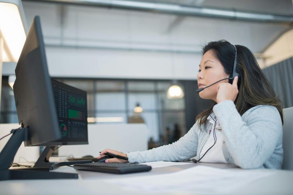 Call center agent speaking with prospects during a cold calling campaign