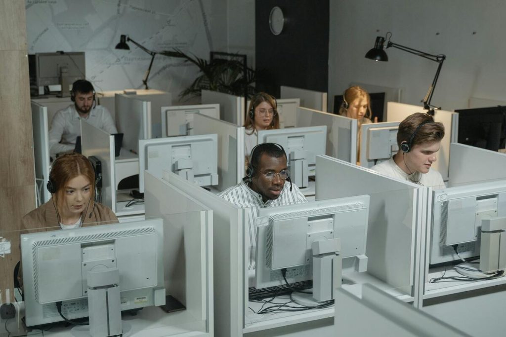 Customer service agents handling customer inquiries using one of the best SaaS help desk tools and agents