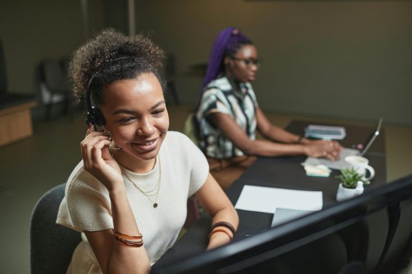 Customer support agents conducting B2B cold calling for lead generation and client engagement
