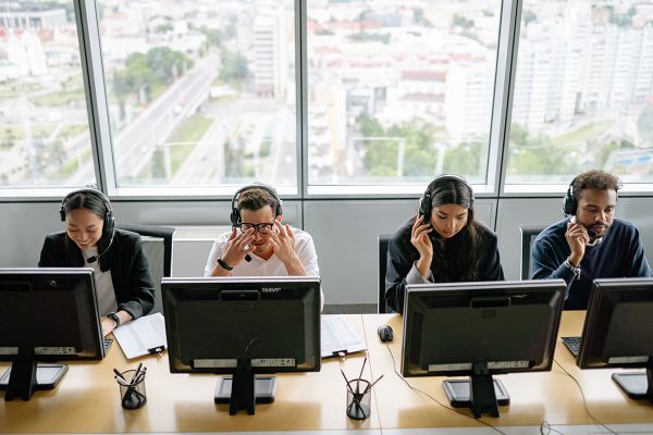 Customer service BPO agents assisting customers by phone 