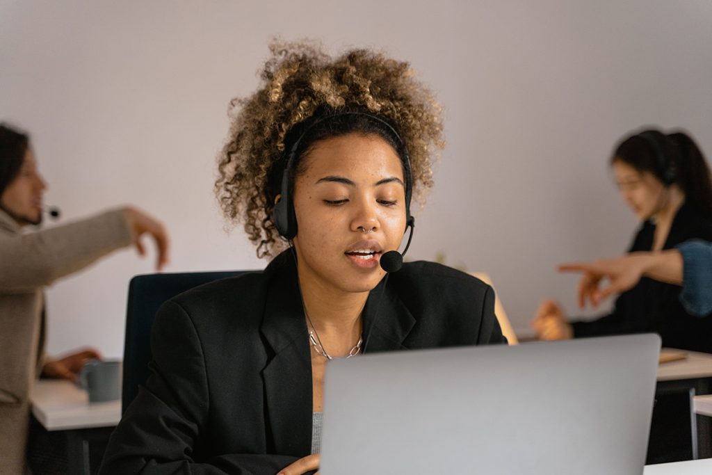 Customer service representative providing live chat outsourcing support