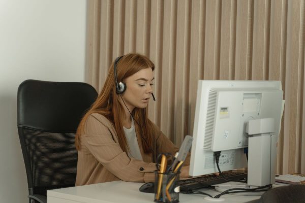 Customer support agent helping small business customers by phone
