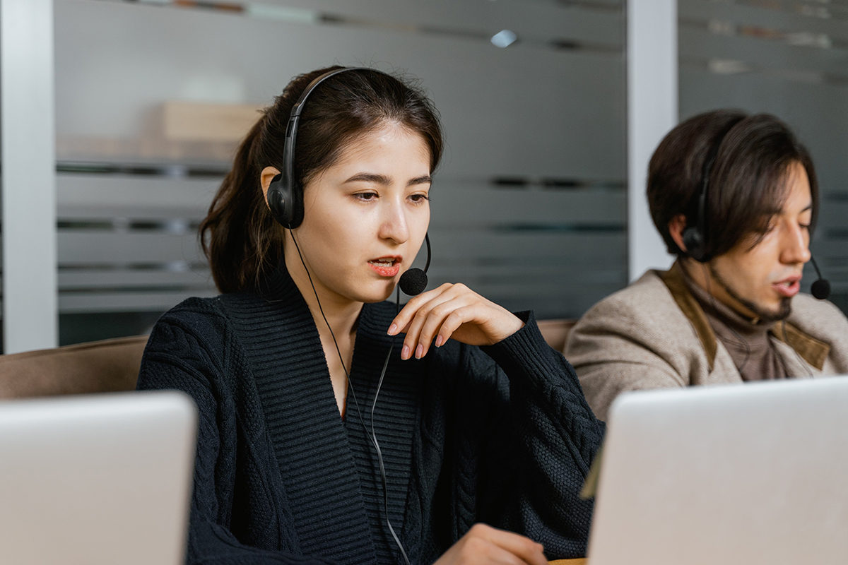 Customer support representatives providing assistance and resolving customer inquiries in a modern call center