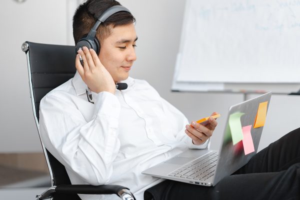 Call center outsourcing agent assisting customers by phone