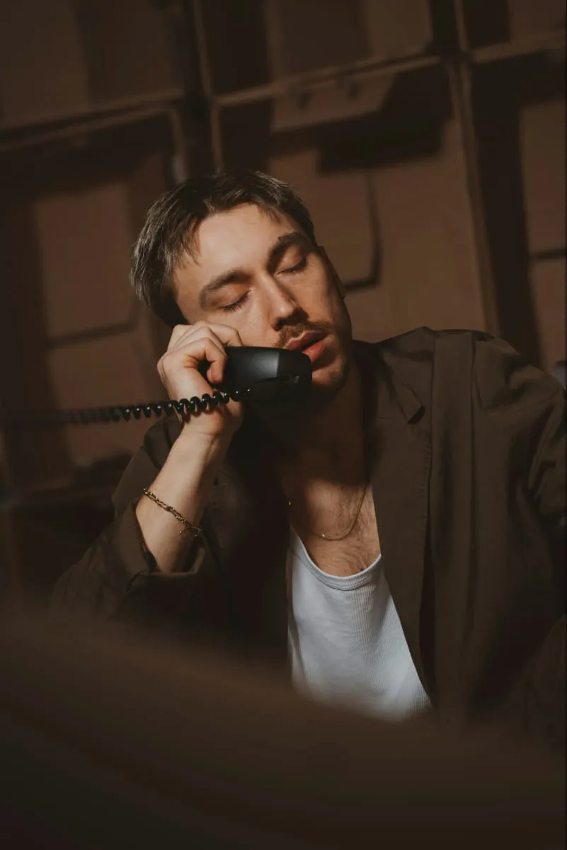 Agent on the phone assisting customers for global customer support teams.