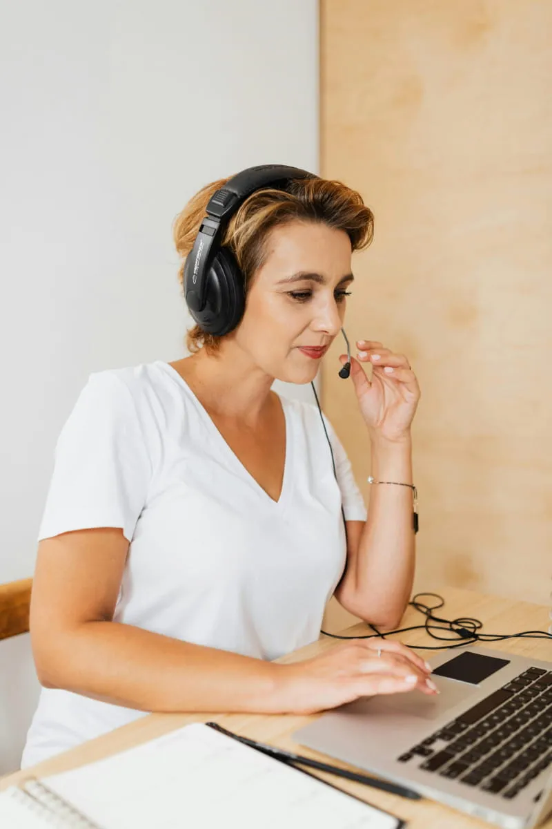 Customer service agent with headset in a call center San Francisco.