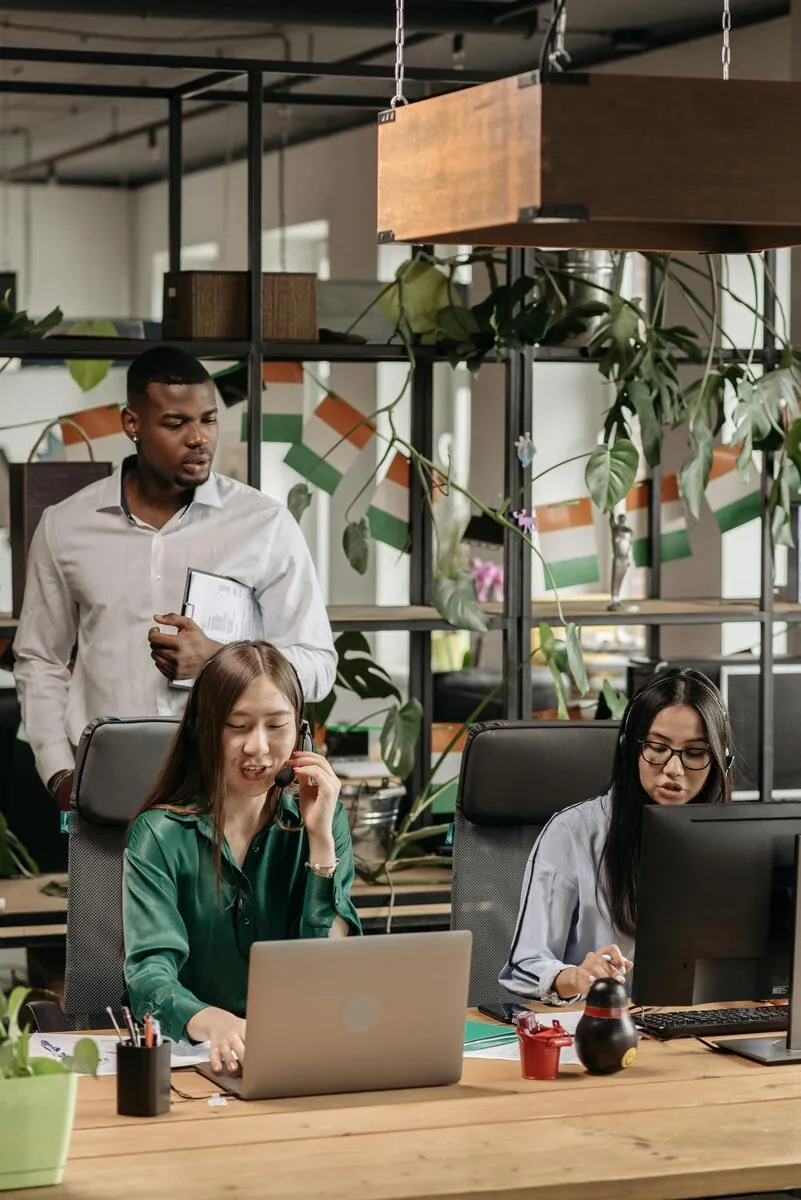 Customer service agents taking calls in a support center, showing order fulfillment process optimization