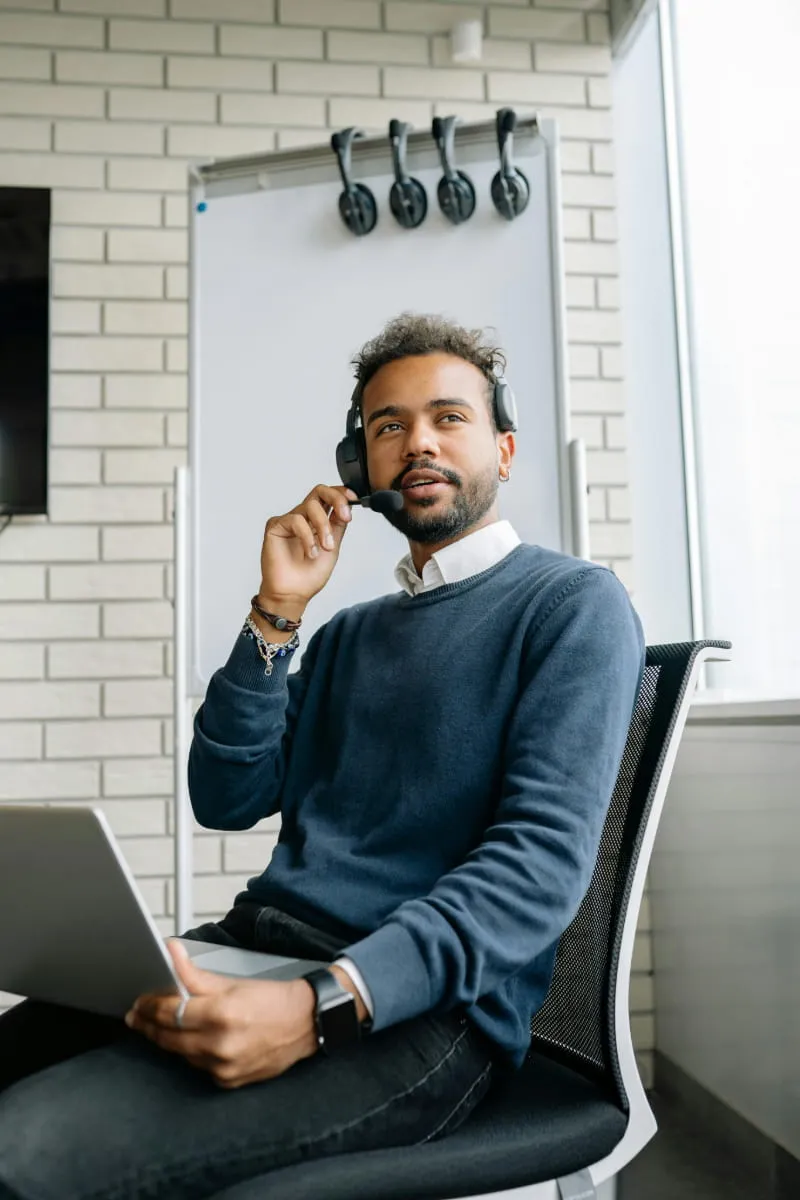 Improving customer experience through attentive support by male agent in office.