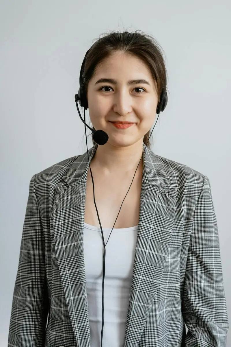 Multilingual customer support representative assisting customers through phone and chat